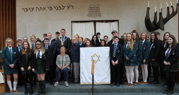 Tomi Reichental and Susan Pollack MBE with Lord Mayor John Finucane and local school pupils at the synagogue in Belfast in October 2019.