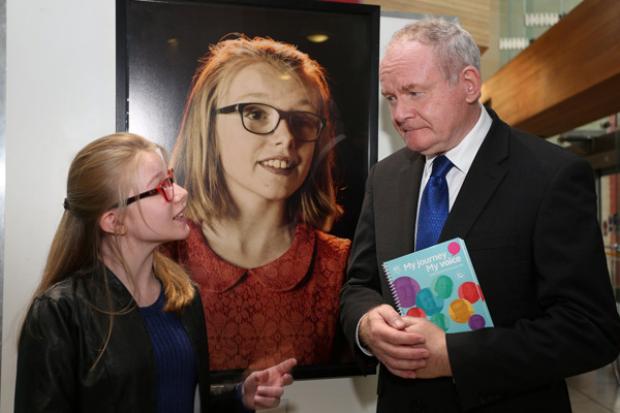 Molly Bradley pictured talking to the deputy First Minister Martin McGuinness about her experience of taking part in the My Journey My Voice exhibition.
