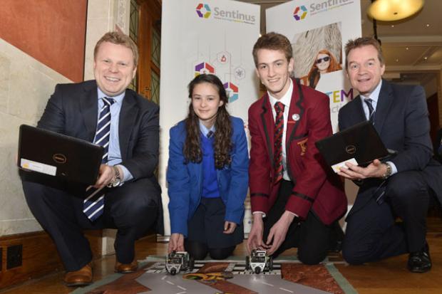 Junior Minister Alastair Ross pictured with Maeve Stillman from St Mary's College in Londonderry, Daniel Stewart from Ballyclare High school and Peter Morris, Head of Operations, BT in Northern Ireland.