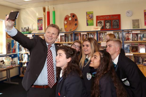 Junior Minister, Alastair Ross gets a quick selfie with some of the pupils rom Malone Integrated College during his visit.
