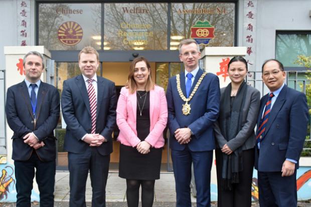 Junior Ministers Alastair Ross and Megan Fearon outside the Chinese Welfare Association headquaters in Belfast