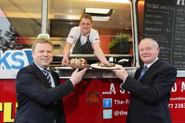 The deputy First Minister, Martin McGuinness and Junior Minister, Alistair Ross pictured with Peter Callan who started his Fat Truck initiative with the support of the Executive funded Social Investment Project through West Belfast Works