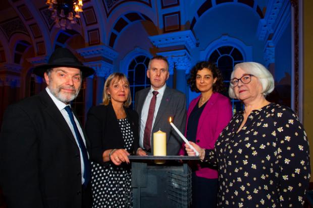 Pictured L-R , Rev David Kale (rep from the Jewish community) Laura Marks, Chair of the HMDT, Head of the Northern Civil Service, David Sterling, Olivia Marks-Woldman, CEO HMDT, with Holocaust survivor Joan Salter MBE, at the Holocaust memorial event