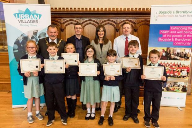 L-R (back row): Maolíosa McHugh, Mayor of Derry and Strabane District Council, Seamus Ward, BBHF, Linsey Farrell, Programme Director, Urban Villages Initiative, Mr Gabriel Kelly, and children from Longtower PS.