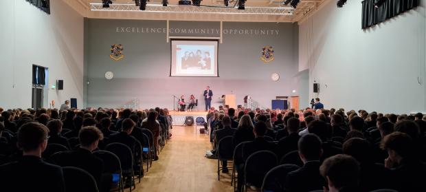 Image of a large room- school assembly learning about HMD