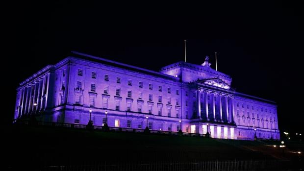 Photograph: Parliament Buildings lit up in purple to commemorate HMD “Light the Darkness” on 27 January 2025.