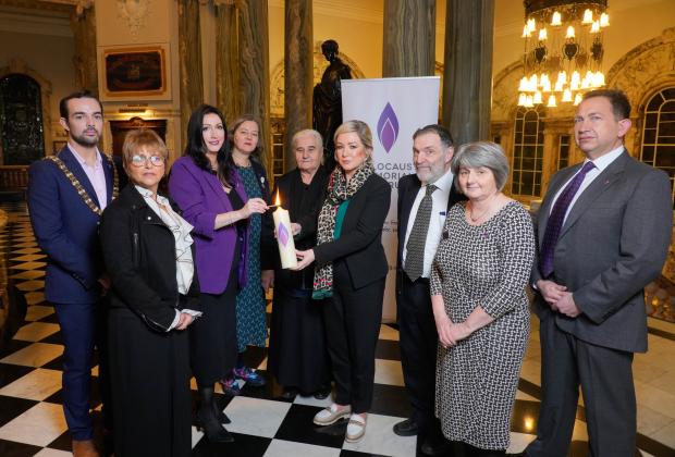 Photograph (from left to right): Lord Mayor of Belfast, Lu Lawrence - daughter of Holocaust survivor Zigi Shipper, dFM Emma Little-Pengelly, Fleur Anderson MP on behalf on the Secretary of State, Munira Subašić - President of the Mothers of Srebrenica, FM Michelle O’Neill, Rabbi David Kale, Shirley Lennon – HMDT, and Paul Lopez-Salzedo – HMDT.