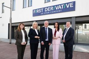 Image of five people standing - Pictured left to right are: Economy Minister Dr Caoimhe Archibald, First Minister Michelle O’Neill, Andrew Colhoun, Head of First Derivative, deputy First Minister Emma Little-Pengelly and Kieran Donoghue, Chief Executive of Invest NI.